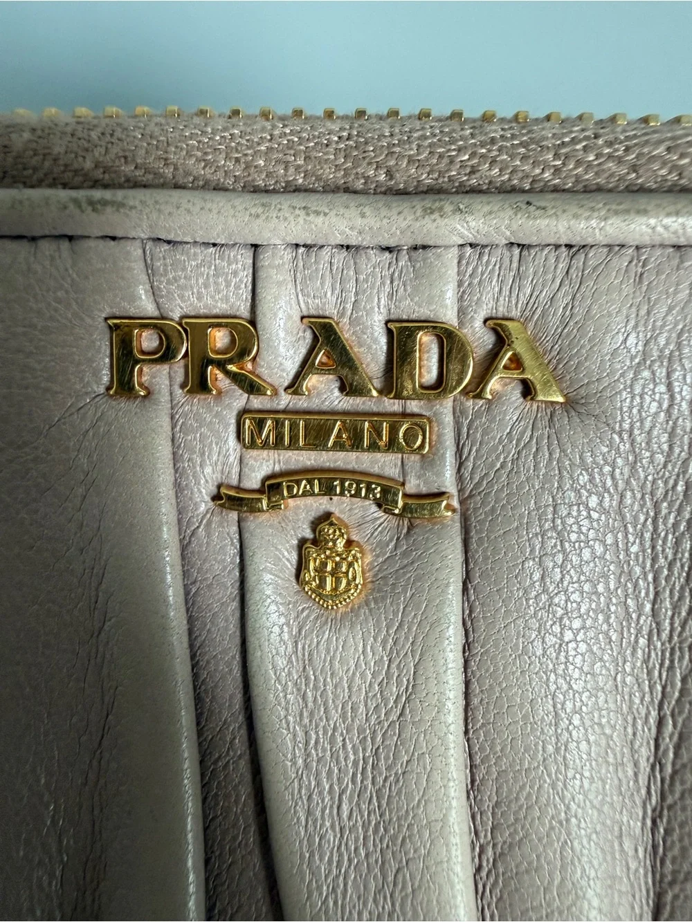 a Nappa Gaufré Leather Zip-Around Wallet – Beige/Blush Pink